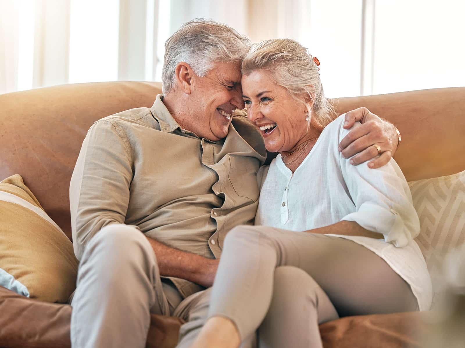 Elderly couple laughing