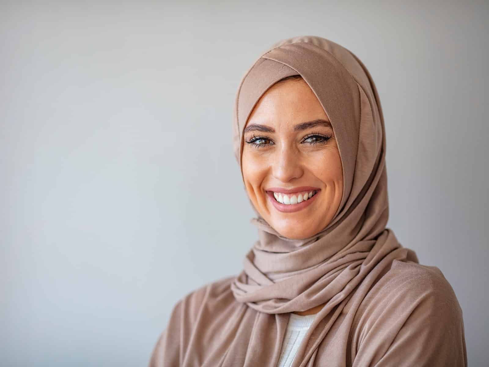 Young woman showing off her smile after a cosmetic dentistry procedure Young woman showing off her smile after a cosmetic dentistry procedure